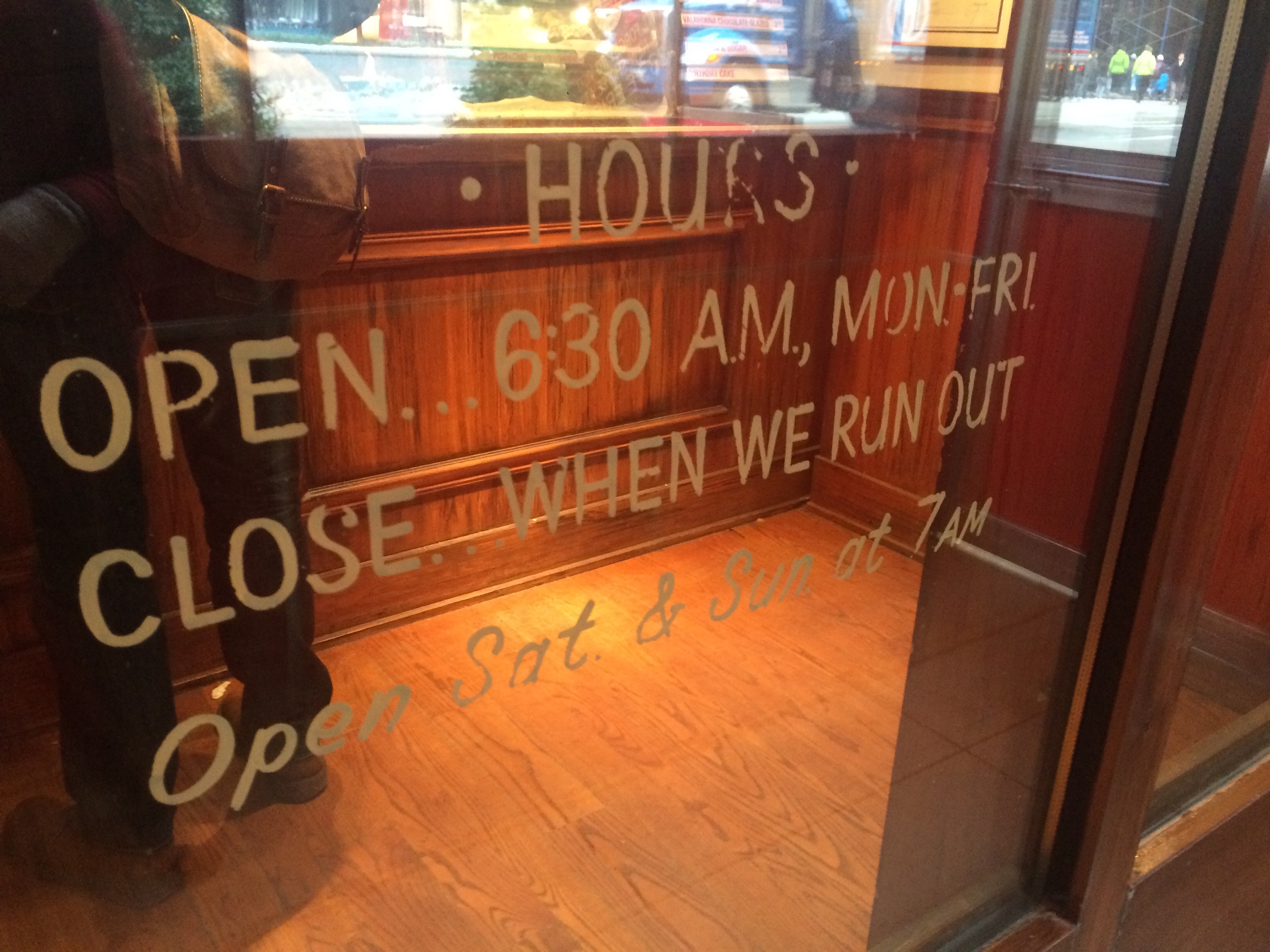 the image is of the front window of the store, showing the hours of operation as: OPEN 6:30AM, Mon-FRI, CLOSE: when we run out, Open Sat & Sun at 7am